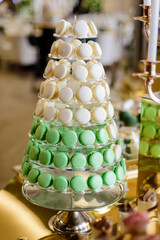 Pyramid of macaroons on candy bar
