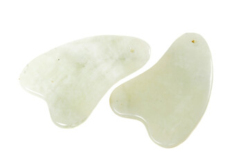 Jade guasha for spa treatments, massage stone on white background.Isolated.Chinese traditional massage - Gua Sha with stone.Jade massage scraper, gemstone .