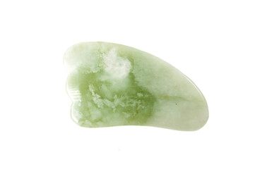 Jade guasha for spa treatments, massage stone on white background.Isolated.Chinese traditional massage - Gua Sha with stone.Jade massage scraper, gemstone .