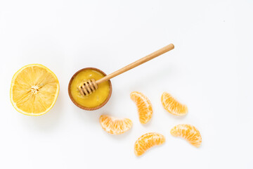 Bowl of honey on white background. Symbol of healthy living and natural medicine. Aromatic and tasty.