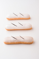 Vanilla eclairs decorated with vanilla pad