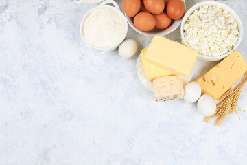 Fototapeta na wymiar Assortment of fresh dairy products, healthy breakfast with ingredients, natural nutrition concept, maintaining healthy intestinal microflora, top view, rustic table, selective focus