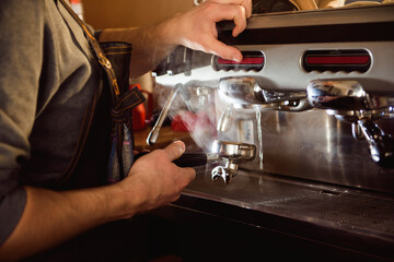 close up barista hand making a cup of coffee