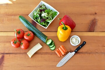 Fresh healthy vegetables ready to prepare nutritious lunchtime salad. Photo concept, food background, flat lay, copy space