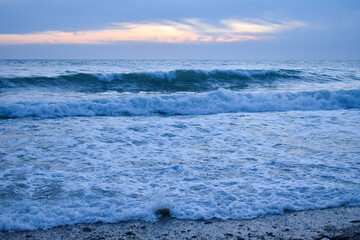 Naklejka na ściany i meble beautiful sunset on the sea.wave