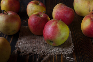 Fresh homemade apples on a wooden table. Rustic still life. 