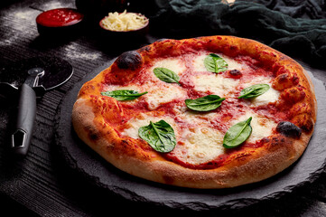 Traditional italian artisanal pizza. tasty and delicious made with tomatoes, cheese and basilico, high quality photo with copyspace