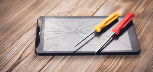 screwdrivers on the broken tablet