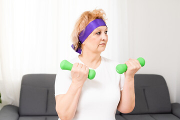 Gym At Home. Positive Aged Woman Training With Dumbbells In Living Room, Copy Space