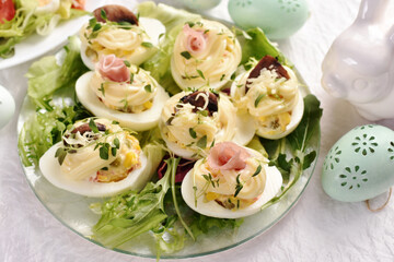 eggs with mayonnaise stuffed with vegetable salad on Easter table