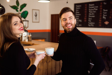 Beautiful Woman And Handsome Man Drinking Coffee While Spending Time In Coffee Shop.
