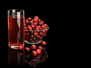 Glass with cranberry berry juice and vase from glass filled with cranberry berries