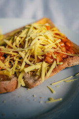 Beans on toast with grated Vegan cheese. 