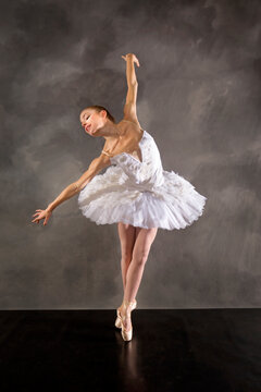 Ballerina in white tutu, dancing in the studio in Connecticut.