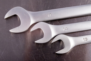 Metal flat workshop wrenches. Accessories for mechanics carrying out repairs in the household.