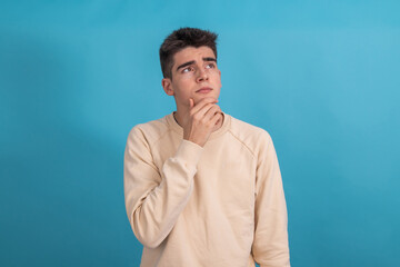 teenager with pensive expression isolated on background