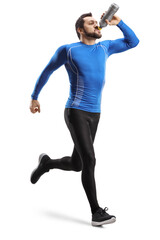 Full length shot of a fit man running  and drinking from a bottle