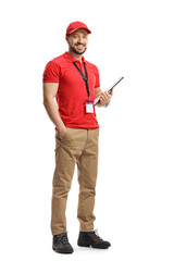 Full length portrait of a male shop assistant holding a clipboard and smiling