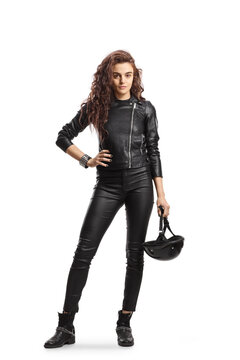 Full length portrait young woman with curly hair holding a biker helmet and wearing a leather jacket