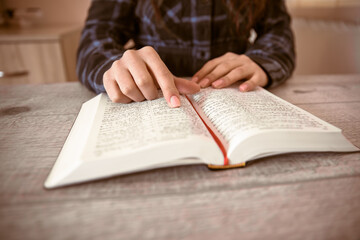 woman reading Holy Bible