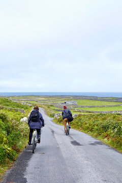 Cyclists on road, Inishmore, Ireland
