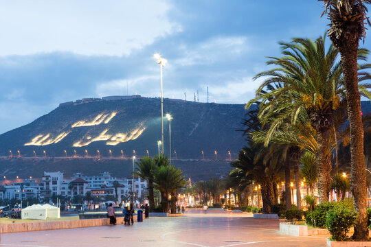 Illuminated hillside at dusk, Agadir, Morocco, Africa