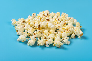 angle view popcorn on a blue background