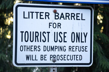 View of sign Litter Barrel for Tourist Use only, Others dumping refuse will be prosecuted in Strathcona Provincial Park
