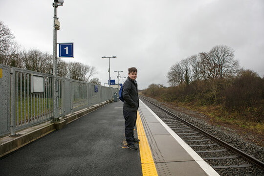 Man with down syndrome on platform in train station, Galway, Ireland