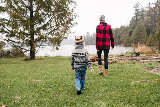 Mother and son on walk by lake, Kingston, Ontario, Canada