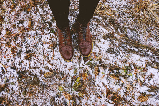 Feet of woman standing in forest in winter, Ural, Sverdlovsk, Russia