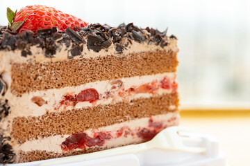 side view chocolate flavor cake with strawberry close up horizontal composition