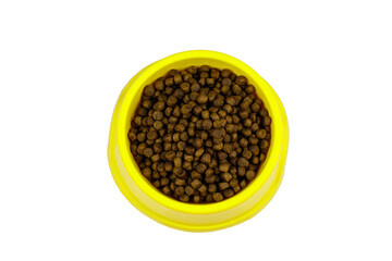 Dry food for cat or dog in a bowl. Top view. Pet food isolated on white background