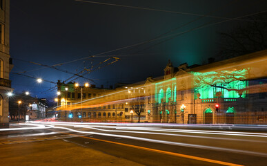 Fototapeta na wymiar Colorful crossed light trails in a night city.