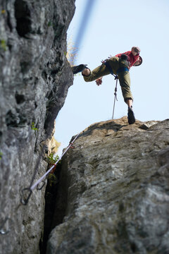 Rock climber jumping over rocks, Chamonix, Rhone-Alps, France