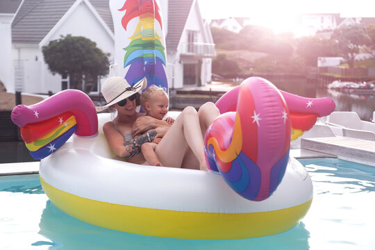 Mother and son in inflatable in pool, St Francis Bay, Eastern Cape, South Africa