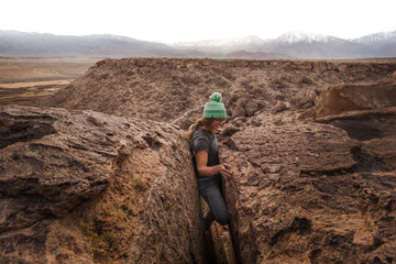 Climber stuck in offwidth crack, Sierra Nevada, Bishop, California, USA