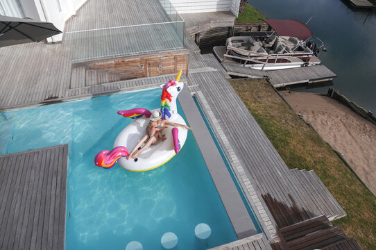 Mother and son in inflatable in pool, St Francis Bay, Eastern Cape, South Africa