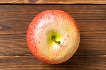 top view artificial apple on a wood table