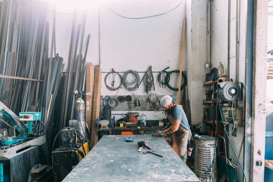 Axe maker in workshop