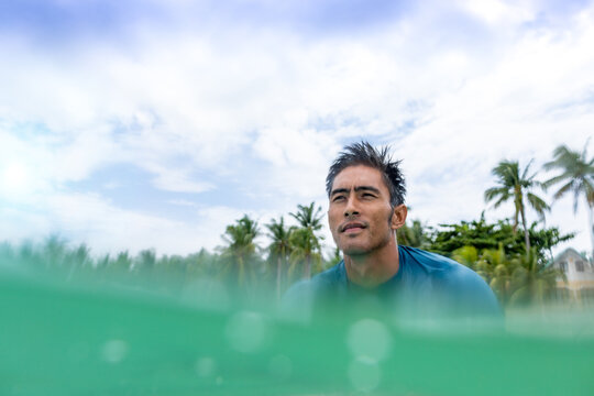 Surfer waiting in sea, Pagudpud, Ilocos Norte, Philippines