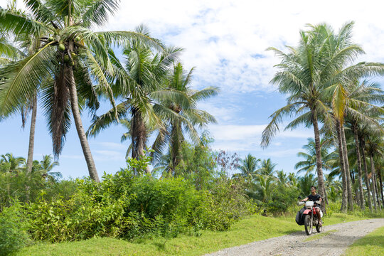 Motorcyclist with surfboard, Abulug, Cagayan, Philippines