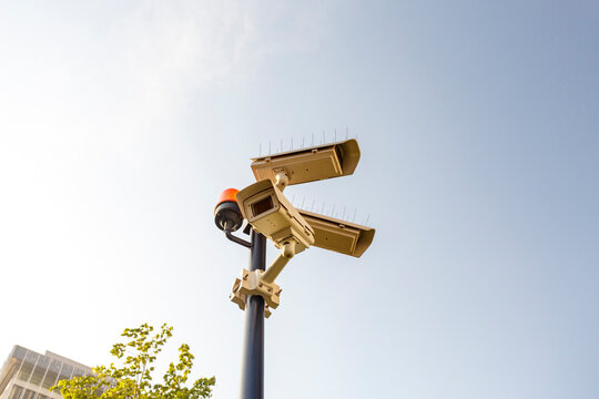 Surveillance camera against clear sunny sky