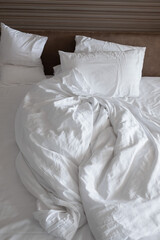 Fototapeta na wymiar white bed background, after sleep, dirty bed