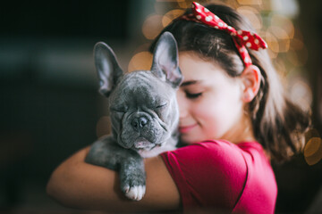 Girl hugging pet dog