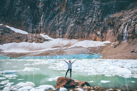 Woman enjoying view by lake, Jasper, Canada