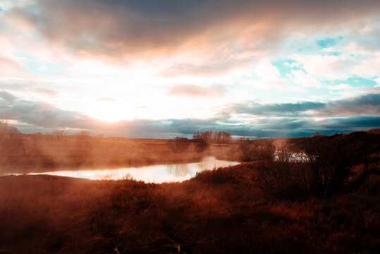 Sunset over lake, Seljavallalaug, Iceland