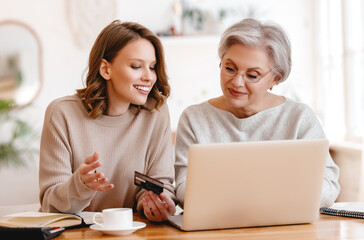 Grandmother and granddaughter shopping online
