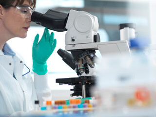 Medical testing of variety of human samples including blood and tissue under microscope in laboratory