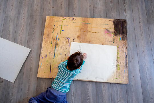 Boy drawing on paper